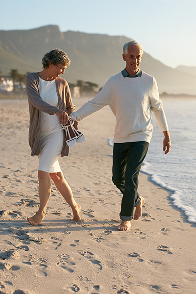 happy couple on beach retirement income strategies columbus oh